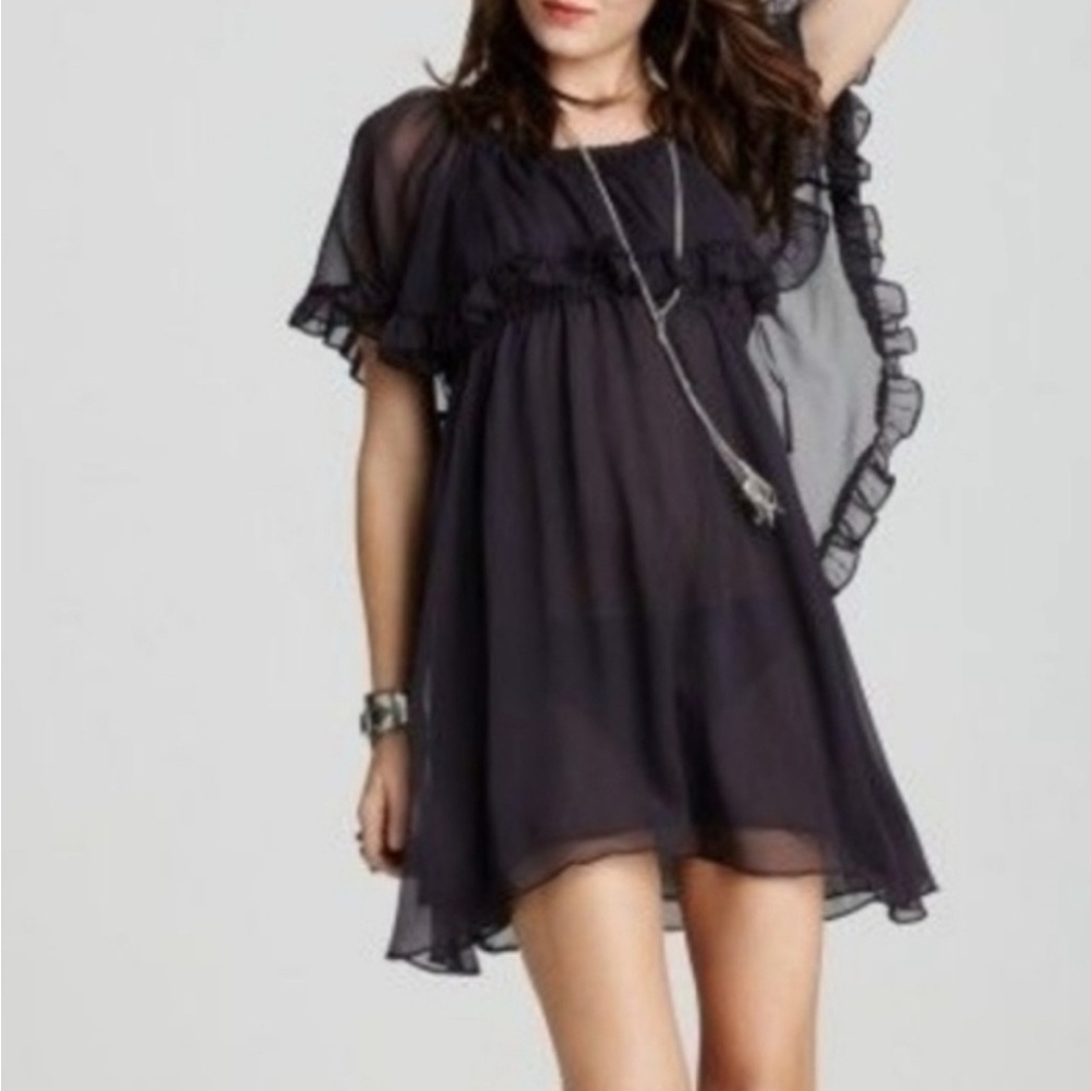 Free people black sheer ruffle dress with soft capelike back.